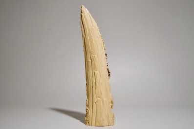 A Chinese carved ivory tusk with a marriage scene, ca. 1900
